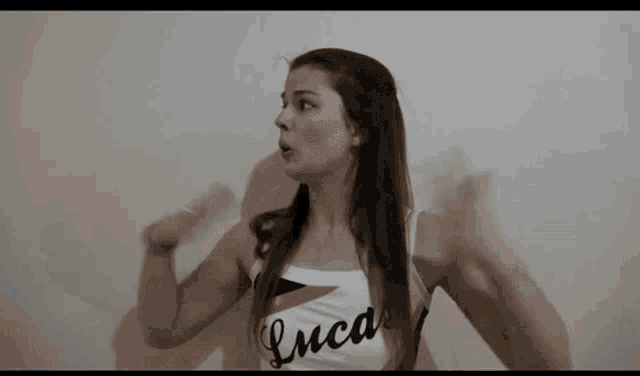 a cheerleader with the name luca on her top