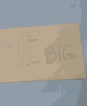 a piece of paper that says " tiny " on it