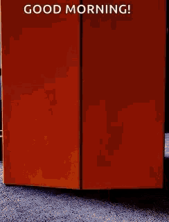 a good morning greeting card with a picture of an orange box on the floor .