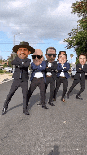a group of men in suits are posing for a photo