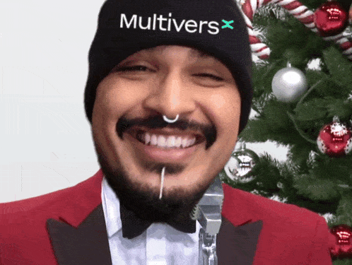 a man wearing a beanie that says multivers x on it