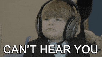 a young boy wearing headphones with the words " can 't hear you " below him