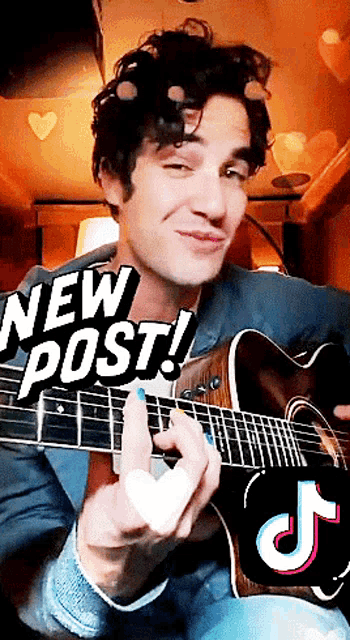 a man playing a guitar with the words " new post " on top