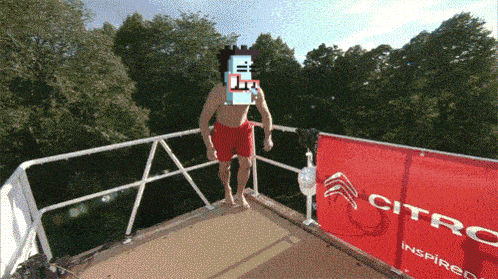 a man in red shorts is standing on a balcony with a citroen banner behind him