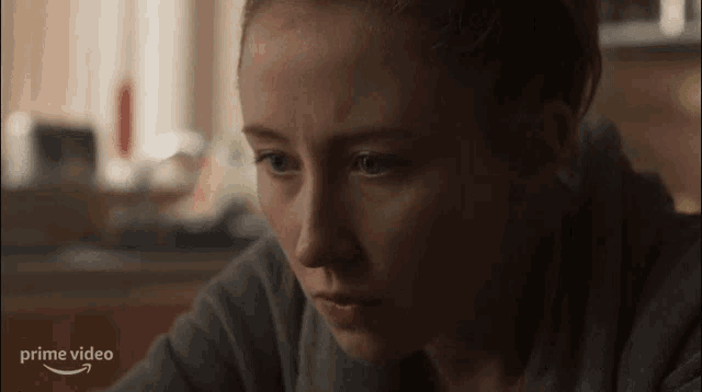 a close up of a woman 's face with the word prime video on the bottom right