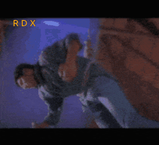 a blurry picture of a man with the word rdx in the corner