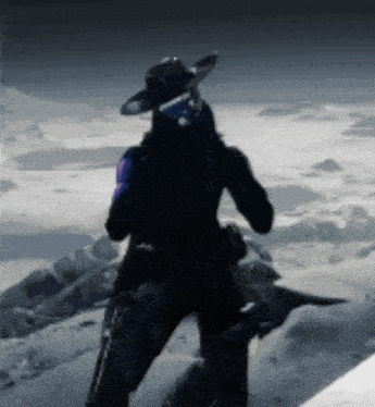 a person wearing a cowboy hat is standing on top of a snow covered mountain