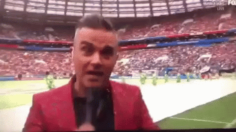 Robbie Williams World Cup GIF - Robbie Williams World Cup Flipping The Bird GIFs