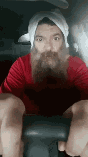 a man with a beard and a towel around his head
