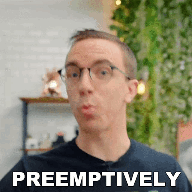 a man wearing glasses is making a funny face and the word preemptively is above him