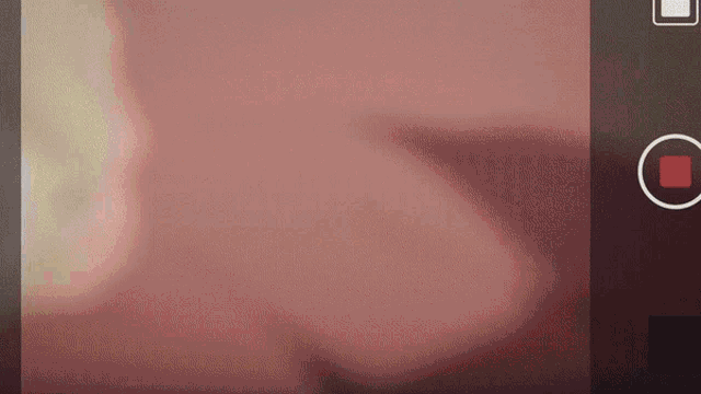 a red circle with a square in it