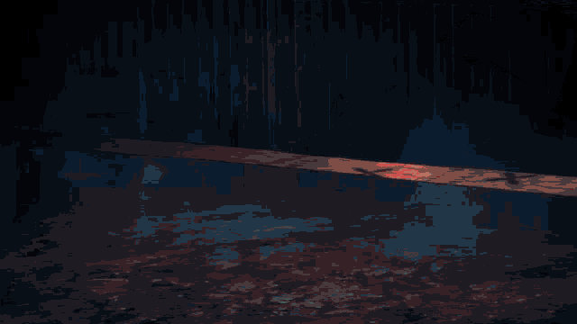 a blurry image of a person in a dark room with a red light behind them
