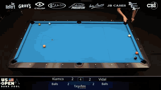 a pool table with the us open bank pool championship on the screen