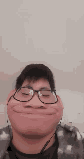 a man wearing glasses makes a funny face