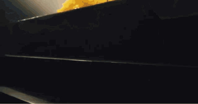 a close up of food being poured into a container
