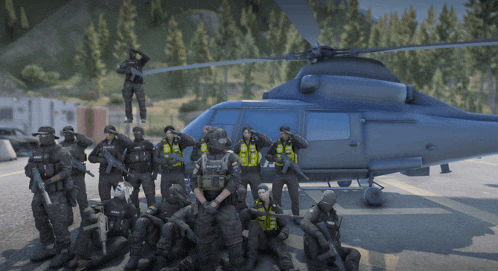 a group of police officers are posing for a photo in front of a helicopter