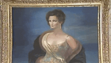 a painting of a woman in a dress is in a gold frame on a wall .