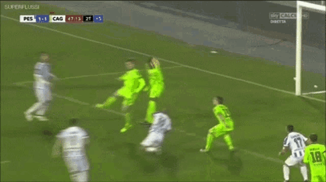 a soccer game is being played with a score of 1-0