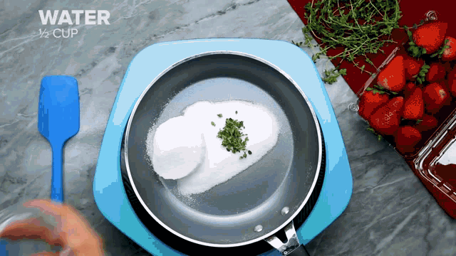 a pan filled with sugar and herbs with the words water 1/2 cup written on the bottom