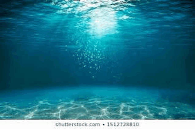 the sun is shining through the water and bubbles are rising from the water .