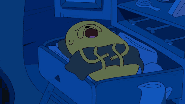 a cartoon character is sleeping in a drawer with bones on the shelves