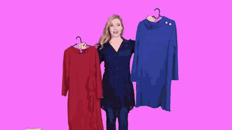 a woman holding a red and a blue dress