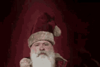 Santa'S Weird Creepy Cap GIF - Hat Creepy Santa Santa Claus GIFs