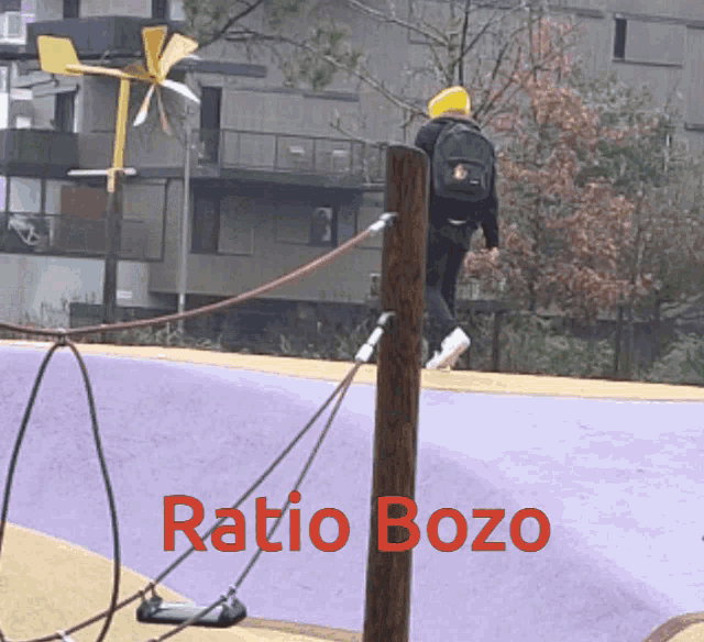 a person with a backpack is standing next to a wooden post that says ratio bozo on it