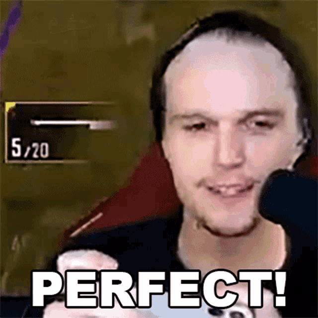 a man wearing a headset says perfect in front of a microphone .