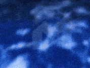 a blurry picture of a blue sky with clouds
