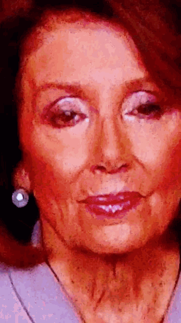 a close up of a woman 's face with red lips