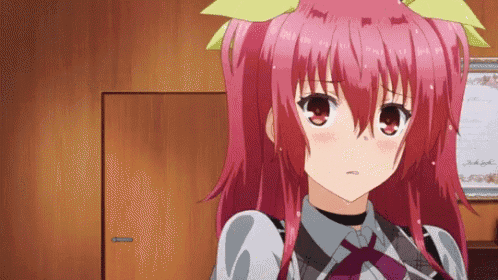 a girl with red hair is standing in front of a wooden door