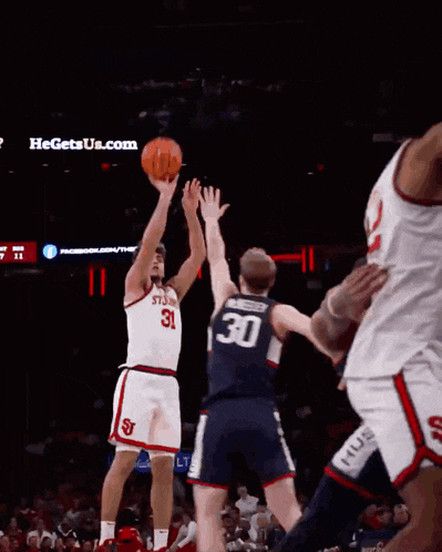 a basketball player wearing a white jersey with the number 11 on it