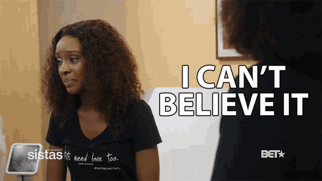 a woman says i can 't believe it while looking at herself in the mirror