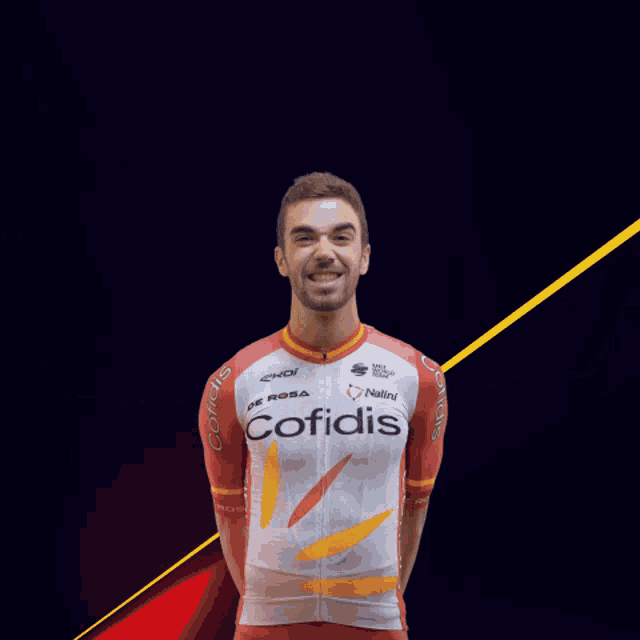 a man wearing a red and white jersey that says cofidis on it