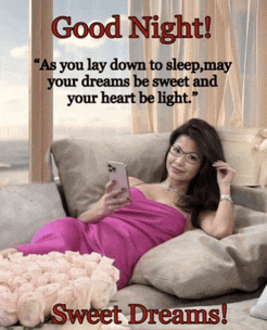 a woman in a pink dress is laying on a couch looking at her cell phone