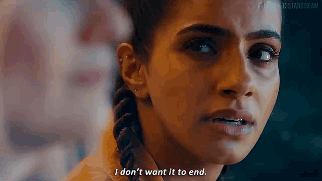 a close up of a woman 's face with the words `` i don 't want it to end ''