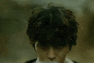 a close up of a person wearing headphones on their head