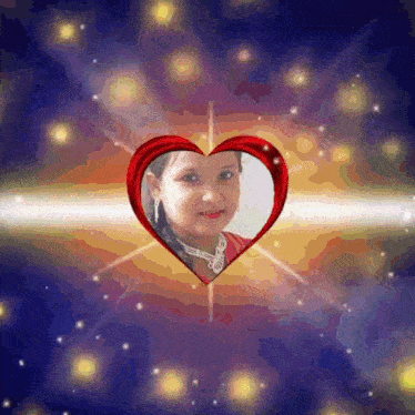 a picture of a little girl in a red heart frame