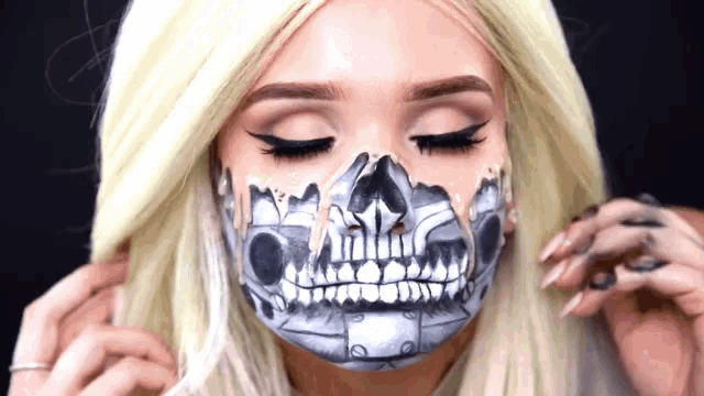a woman with a skeleton painted on her face