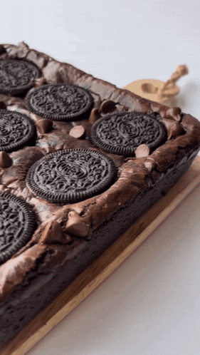 a brownie with chocolate chips and oreos on top