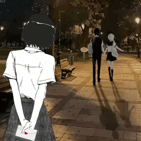 a girl is holding an envelope with a heart on it in front of a man and a woman