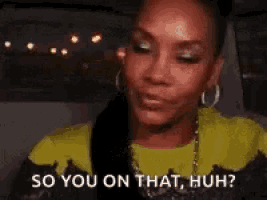 a woman is sitting in a car and says so you on that huh .