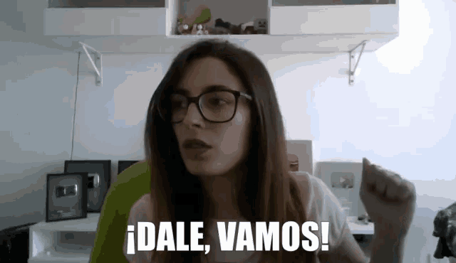 a woman with glasses says dale vamos