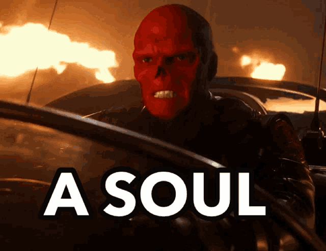 a man with a red skull on his face is driving a car with the words a soul above him