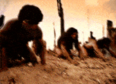 a blurry picture of a group of people crawling on the ground