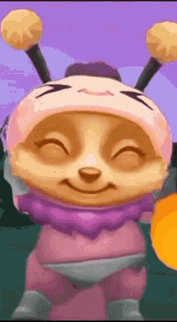 a cartoon bear wearing a bee costume is smiling and holding an orange .