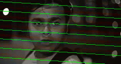 a black and white photo of a man 's face with green lines behind him