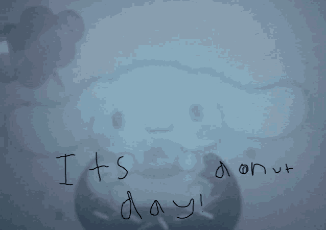 a drawing of a stuffed animal with the words " it 's donut day " written on it