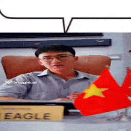 a man sits at a desk with a sign that says eagle on it